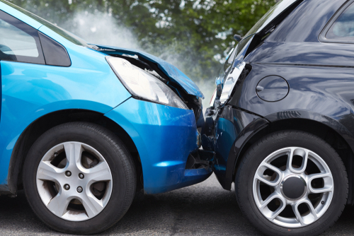 Close,up,of,two,cars,damaged,in,road,traffic,accident